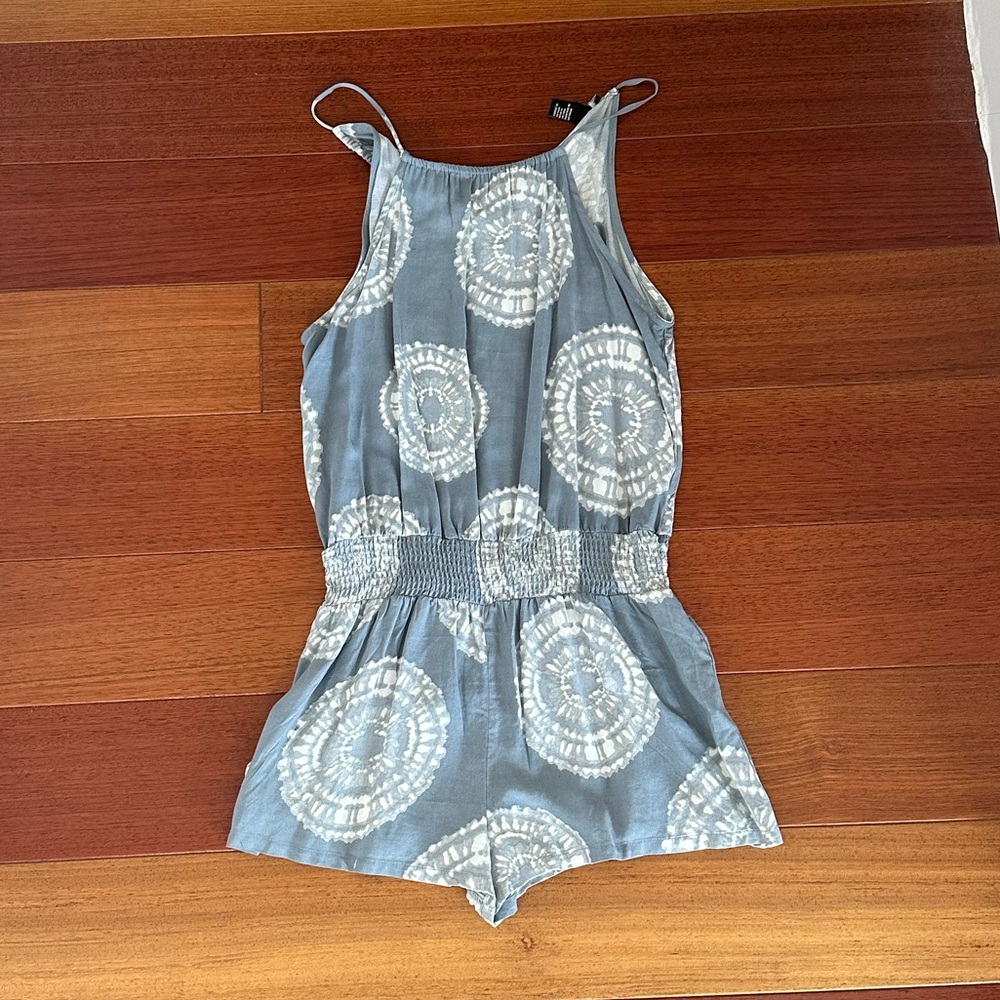Blue and white romper with a tie dye pattern